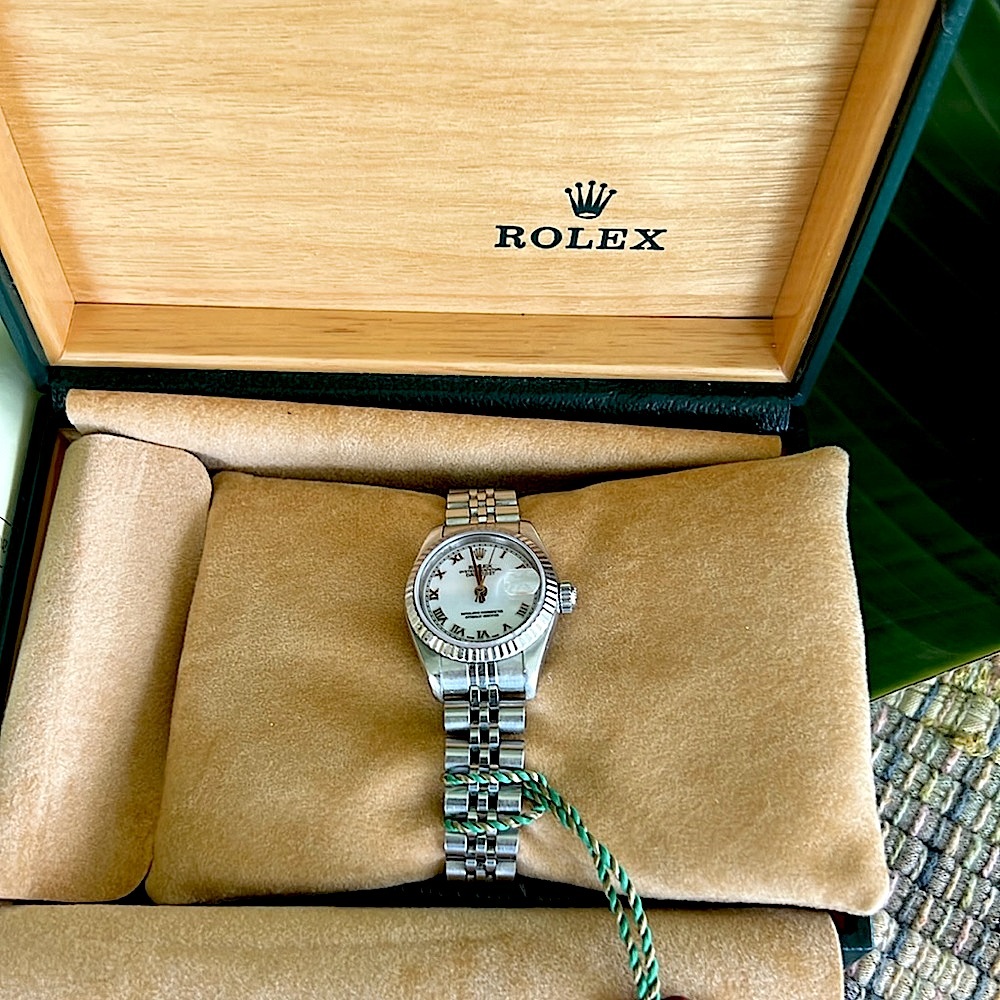 Rolex Watch White Roman Bold Dial. All paper work included.